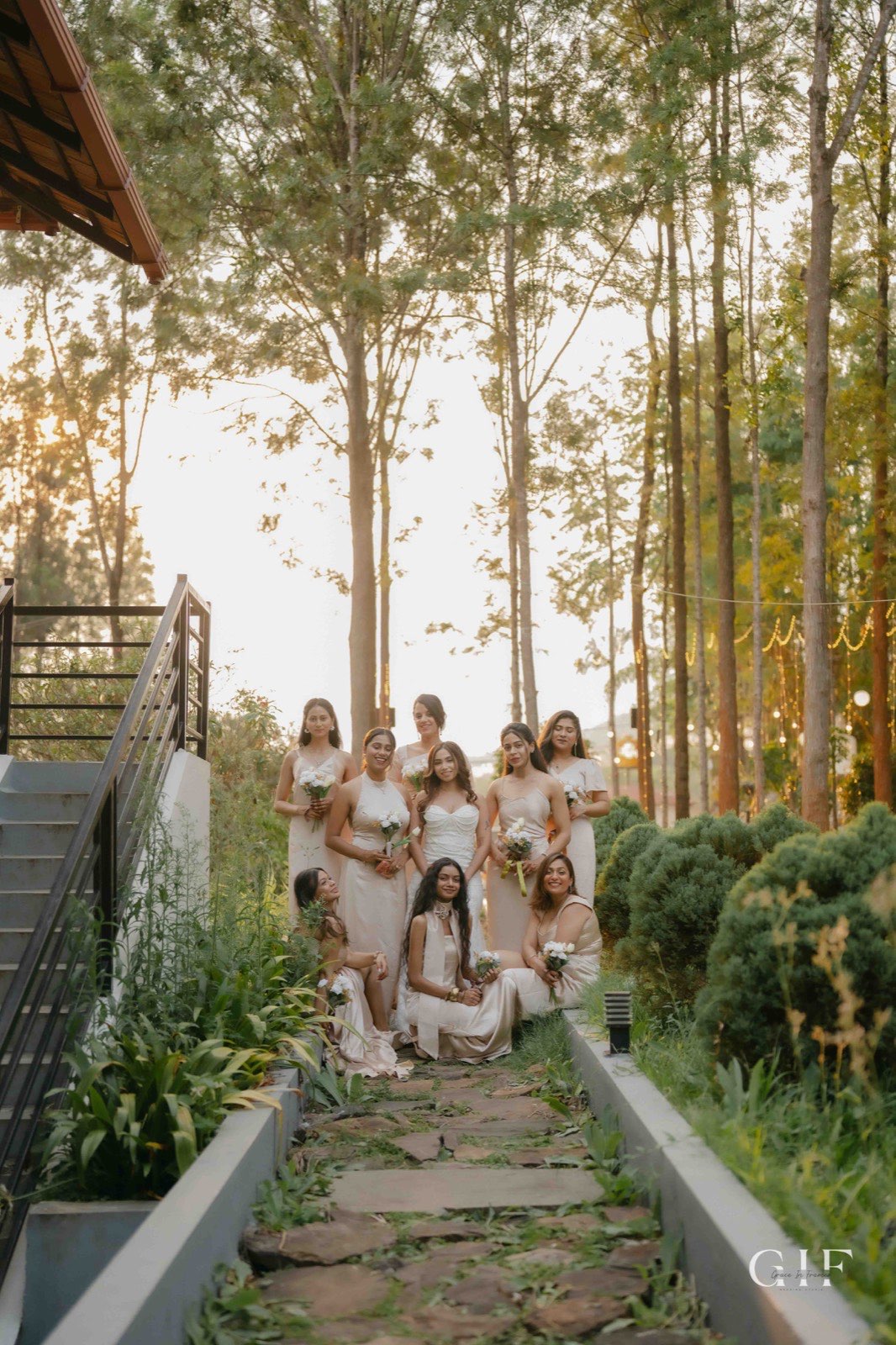 Pranita posing with her bridal party in a garden